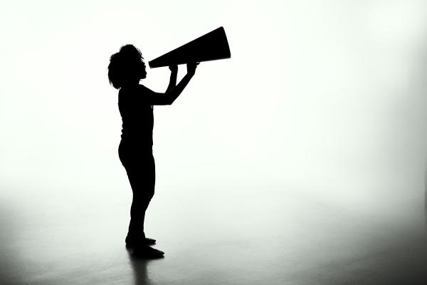 person speaking in megaphone